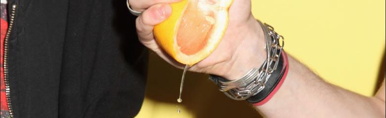 grapefruit being squeezed 